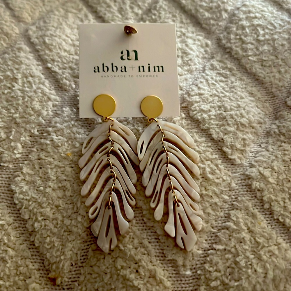 Brand new never wore bone feather earrings